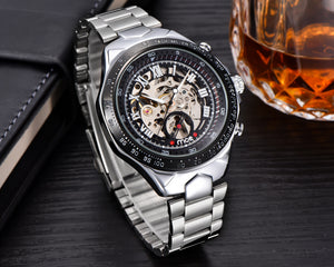 Mechanical watches and men’s mechanical watches displayed elegantly beside a glass of whiskey.
